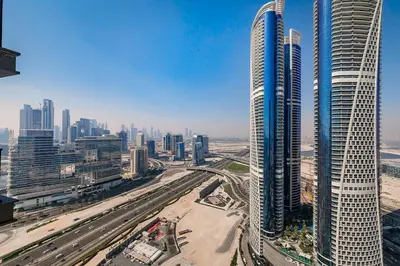 an aerial view of a city with tall buildings at Nobles Tower tiger one skyline view in Dubai