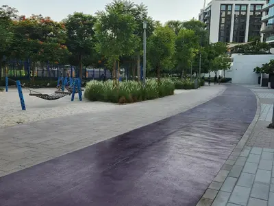 an empty street in a park with trees at Air Homes - Stylish 2BR Near Dubai Hills Mall & Park in Dubai