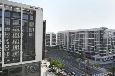 an aerial view of a city with tall buildings at Air Homes - Stylish 2BR Near Dubai Hills Mall & Park in Dubai