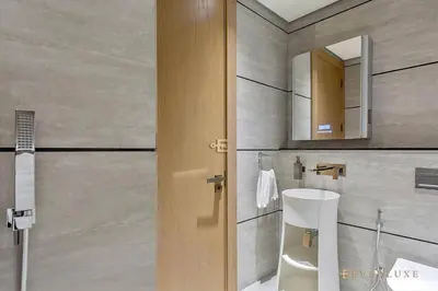 a bathroom with a sink and a mirror at Contemporary Studio Terrace Luxe & Secure Stay in Dubai