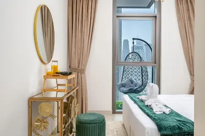 a hotel room with a view of the city at Stylish 2BR with Boulevard View & 5 min from Dubai Mall in Dubai