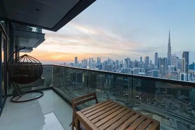 a balcony with a bench and a view of a city at Full Burj khalifa view 41 Floor in Dubai