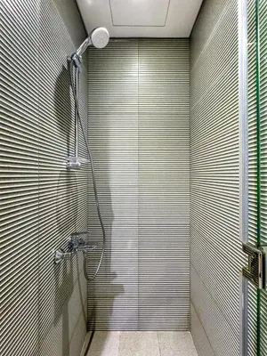 a bathroom with a shower with a glass door at Modern 1BR in Business Bay - Balcony with Skyline Views in Dubai