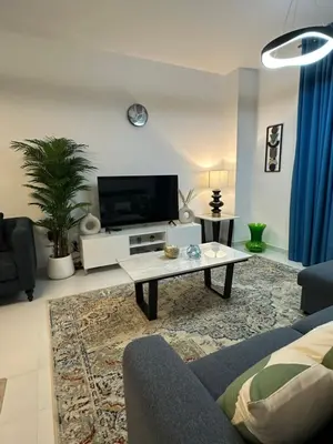a living room with a couch and a coffee table at C Infinity Holiday Homes in Dubai Marina in Dubai