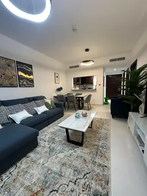 a living room with a couch and a table at C Infinity Holiday Homes in Dubai Marina in Dubai