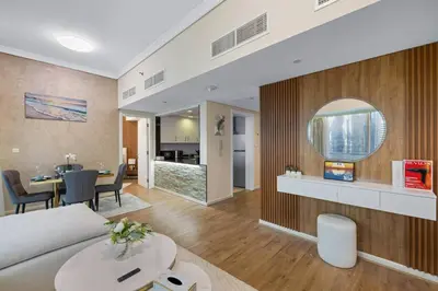 a living room with a couch and a table at Elegant Haven and Spacious 2BR in Lake Terrace in Dubai