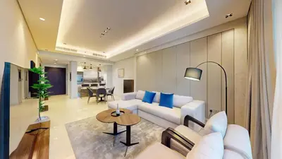 a living room with a white couch and a table at Vacationer I Vista 2 Bedroom I Business Bay I Free Parking, Pool, Gym & Wi-Fi in Dubai