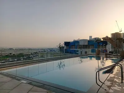 a swimming pool on the roof of a building at Vacationer I Vista 2 Bedroom I Business Bay I Free Parking, Pool, Gym & Wi-Fi in Dubai