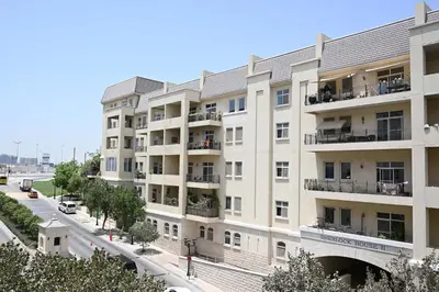 an apartment building on a city street at Air Homes - Stylish Urban Living in a Modern 1BR in Dubai