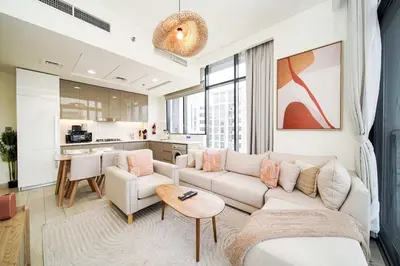 a living room with a couch and a table at PVH - Stylish 1BR Near Dubai Mall - Azizi Riviera in Dubai