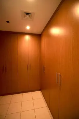 a room with wooden cabinets and a tile floor at Nivis find- Luxury 1 BHK nearby Dubai Mall in Dubai