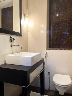 a bathroom with a sink and a toilet at Luxury 2BR with Contemporary Design & Great Views in Dubai