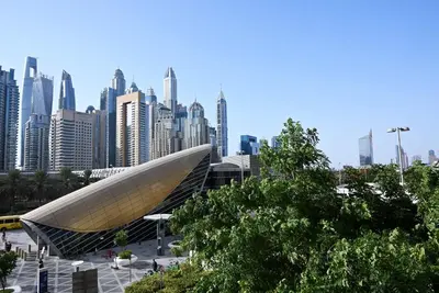 a view of a building with a city in the background at Luxury 2BR with Contemporary Design & Great Views in Dubai