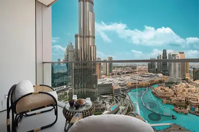 a balcony with a view of a city skyline at Luxury 2BR Burj Fountain View Walk to Dubai Mall in Dubai