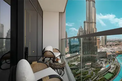 an apartment balcony with a view of a city at Luxury 2BR Burj Fountain View Walk to Dubai Mall in Dubai