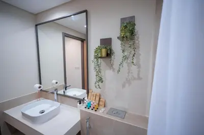 a bathroom with a sink and a mirror at Modern 1BR 4 Guests Dubai World Trade Center in Dubai