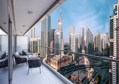 a balcony with a view of a city skyline at Paramount Midtown Hotel - Luxury Apartments & Infinity Pool with Burj Khalifa View in Dubai