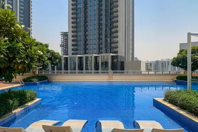 a large swimming pool on the roof of a building at Vogue Creek Harbour, Harbour Views Tower Waterfront Living Close to Downtown, Burj Khalifa and Dubai Mall, One Bedroom Apartment with Balcony and Canal View, Access to all Amenities in Dubai