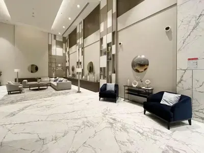 a lobby with couches and chairs and a large marble floor at Vogue Creek Harbour, Harbour Views Tower Waterfront Living Close to Downtown, Burj Khalifa and Dubai Mall, One Bedroom Apartment with Balcony and Canal View, Access to all Amenities in Dubai