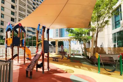 a playground in a building with a slide and swings at The Fountain Views Suite in Downtown Dubai in Dubai