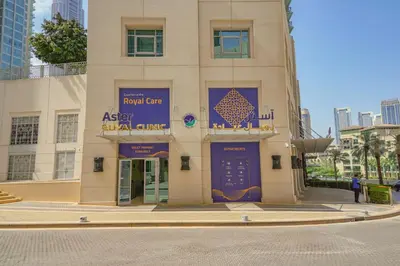 a building with a blue sign on the front of it at The Fountain Views Suite in Downtown Dubai in Dubai