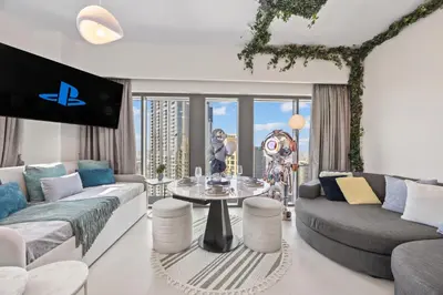 a living room with a couch and a table at Burj Khalifa View - Immersive Expérience - Downtown - DUBAI 3BR in Dubai