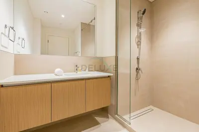 a bathroom with a sink and a shower at Lagoon and Beach Access, Near Festival City Mall, Mins From Downtown Dubai, Rosewater at Creek Beach Building 2, Creek Beach by Deluxe Holiday Homes in Dubai
