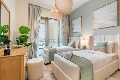a bedroom with two beds and a couch and a window at Lagoon and Beach Access, Near Festival City Mall, Mins From Downtown Dubai, Rosewater at Creek Beach Building 2, Creek Beach by Deluxe Holiday Homes in Dubai