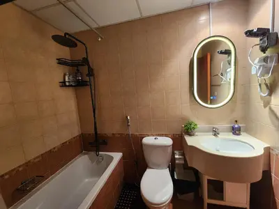 a bathroom with a sink and a toilet and a tub at Livincci - Luxury Studio in Dubai Marina - 16 in Dubai