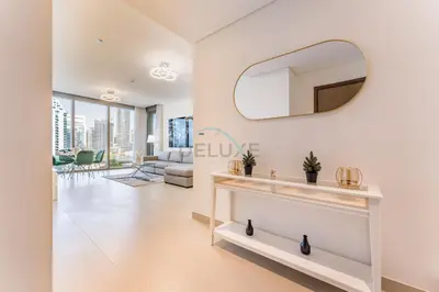 a living room with a mirror on the wall at Short walk to Marina Walk and JBR Beach, close to Bluewaters Island and Ain Dubai, 5242 Tower 1, Dubai Marina by Deluxe Holiday Homes in Dubai