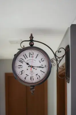 a clock hanging from the ceiling in a room at Luxury High floor apartment Atlantis & palm view in Dubai