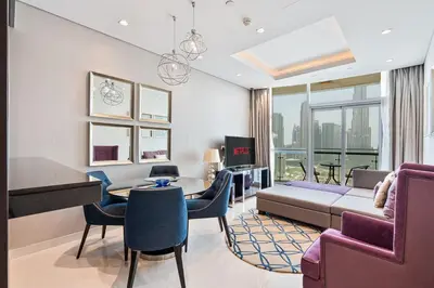 a living room with a couch and a table at Stylish 2BR - Near Burj Khalifa & City Views in Dubai