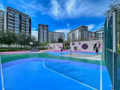 a basketball court in a city with buildings at GuestReady - Golden paradise in Dubai Hills in Dubai