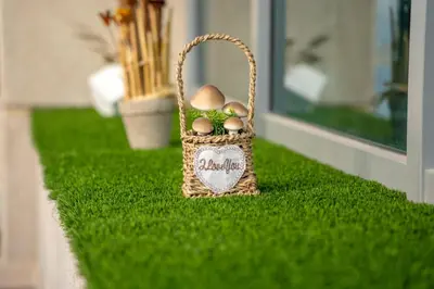 a basket with eggs in it sitting on the grass at White House With Burj Views, Free Parking in Dubai