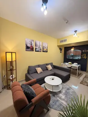 a living room with a couch and a table at Livincci - Luxury 1 Bed Apartment in JLT-10 in Dubai