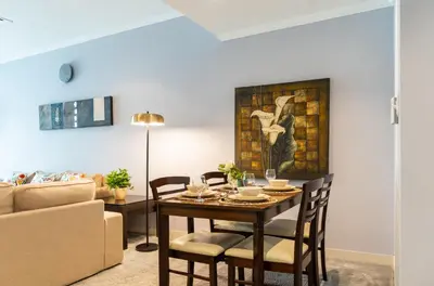a dining room with a table and chairs at Peace Of The Soul By Lagom Jumeirah Lake Towers in Dubai