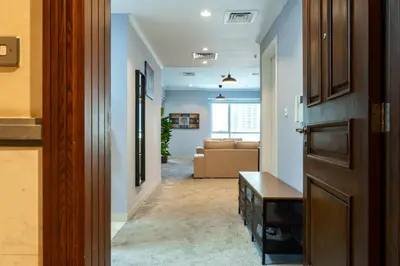 a hallway with a living room with a couch at Peace Of The Soul By Lagom Jumeirah Lake Towers in Dubai