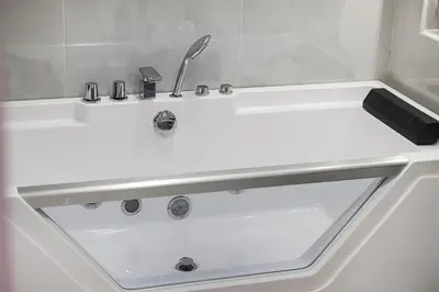 a white sink with a faucet in a bathroom at Chic 2BR Steps to JBR Beach in Dubai