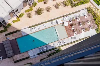 an overhead view of a swimming pool in a building at Creek Harbour Skyline Burj Khalifa & Sea View in Dubai