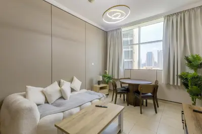 a living room with a couch and a table at Apartment in Downtown As Dormitory Room for male in Dubai