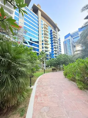 a walkway in front of a large building at Oceana Residences Holiday Beach Home in Dubai