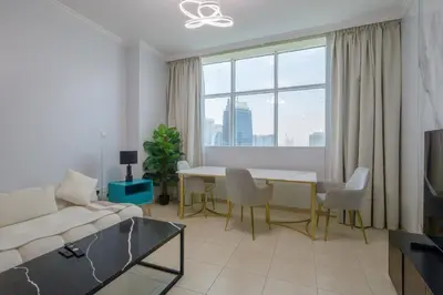a living room with a couch and a table at Apartment in Downtown As Dormitory Room for female in Dubai