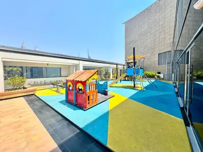 a playground in a building with a play equipment at Luxury 2BR Sky Gardens Appartment Downtown DIFC in Dubai