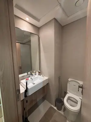 a bathroom with a sink and a toilet at Azizi Riviera 1 A in Dubai