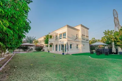 a large white house with a large yard at Dubai Villa - Beautifully Appointed in Dubai
