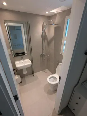 a bathroom with a toilet and a sink at Dubai Villa - Beautifully Appointed in Dubai