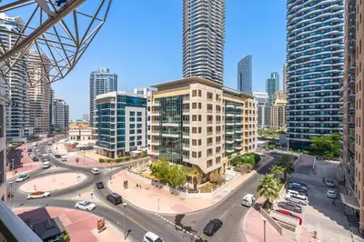 a city with a street with cars and buildings at PVH - 2BR near Marina Promenade - Marina Pearl in Dubai