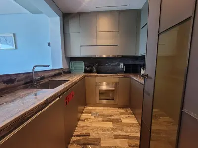 a kitchen with a sink and a counter top at Damac Heights - Blue Ocean Holiday Homes in Dubai