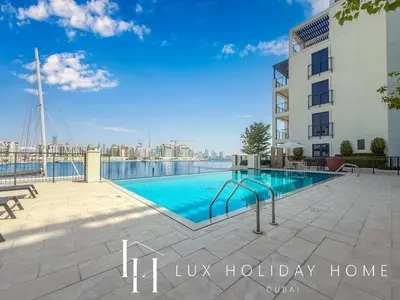 a swimming pool on the roof of a building at LUX The Le Pont Sea View Suite in Dubai