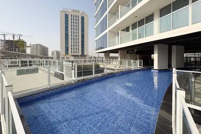 a swimming pool on the roof of a building at Luxury 3Br Apts with Private Pool in Gemz by Simply Comfort in Dubai